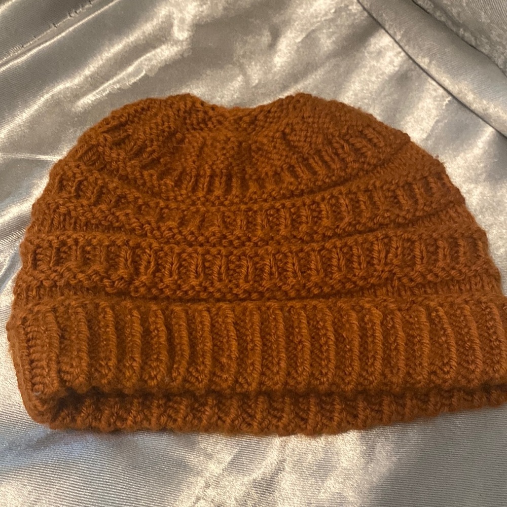 Orange knit ponytail beanie